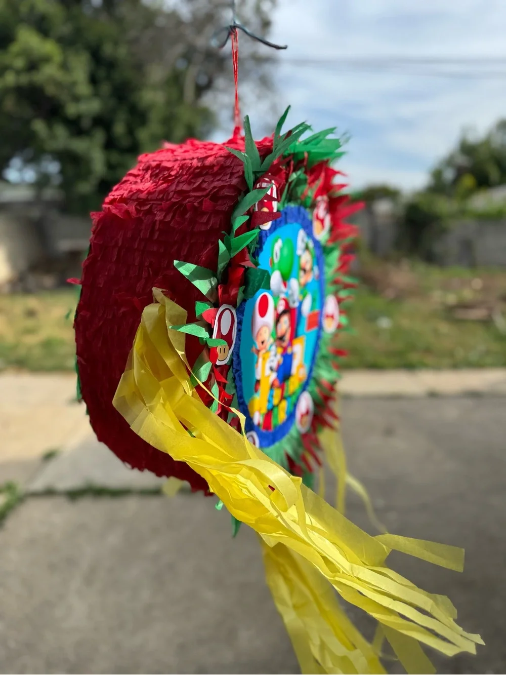 Super Mario Red & Green Party Piñata with Yellow Streamers